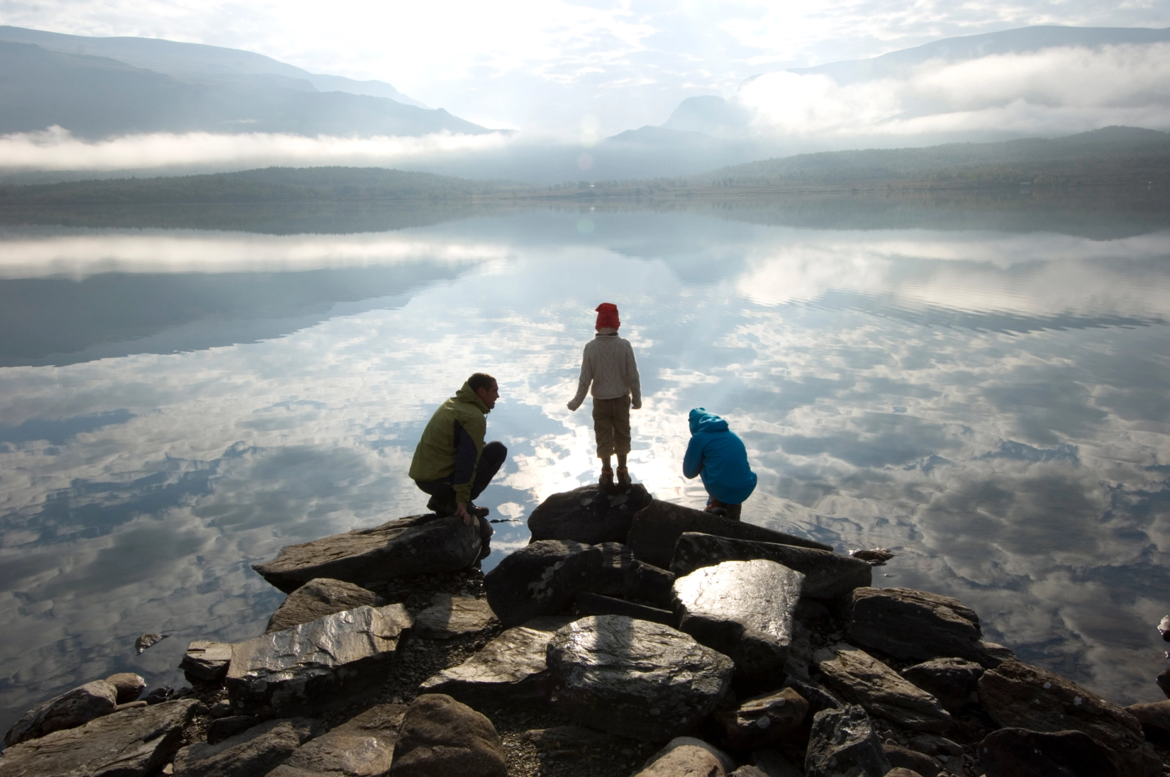 Man and children by lake in Jotunheimen_Terje Rakke - VisitNorway.com.jpg