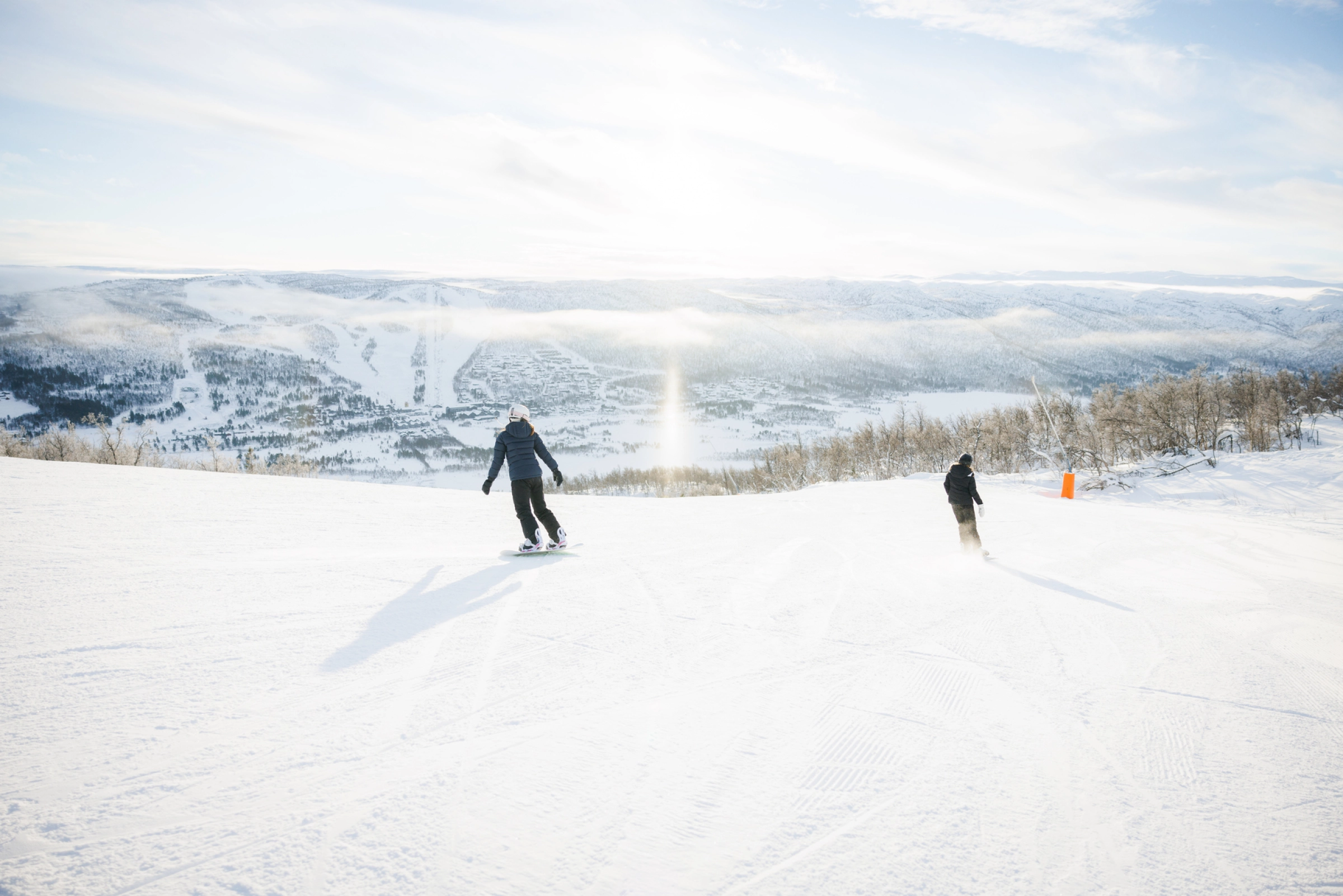 2 people in the slopes. Photo. Paul Lockhart.