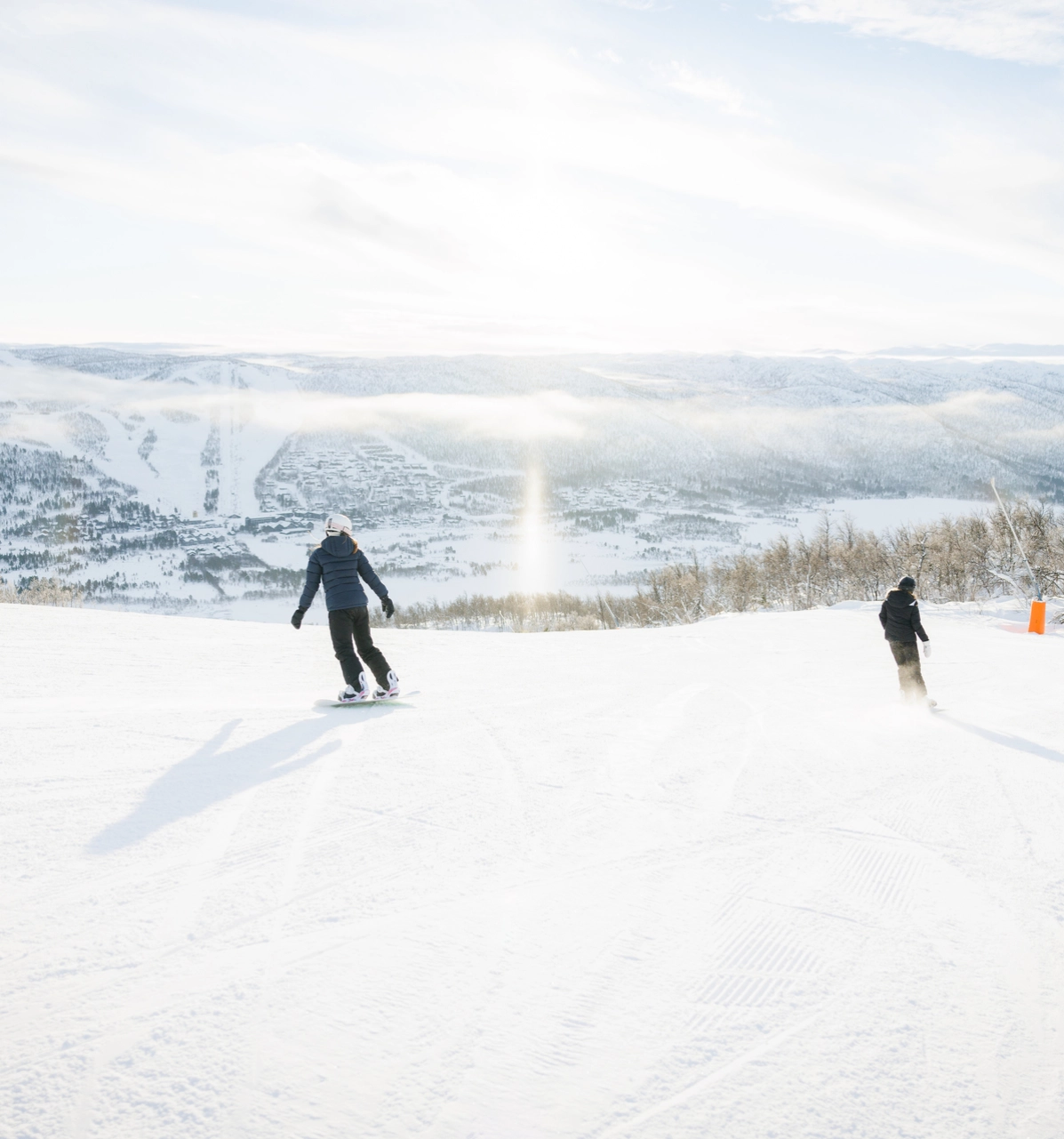 2 people in the slopes. Photo. Paul Lockhart.